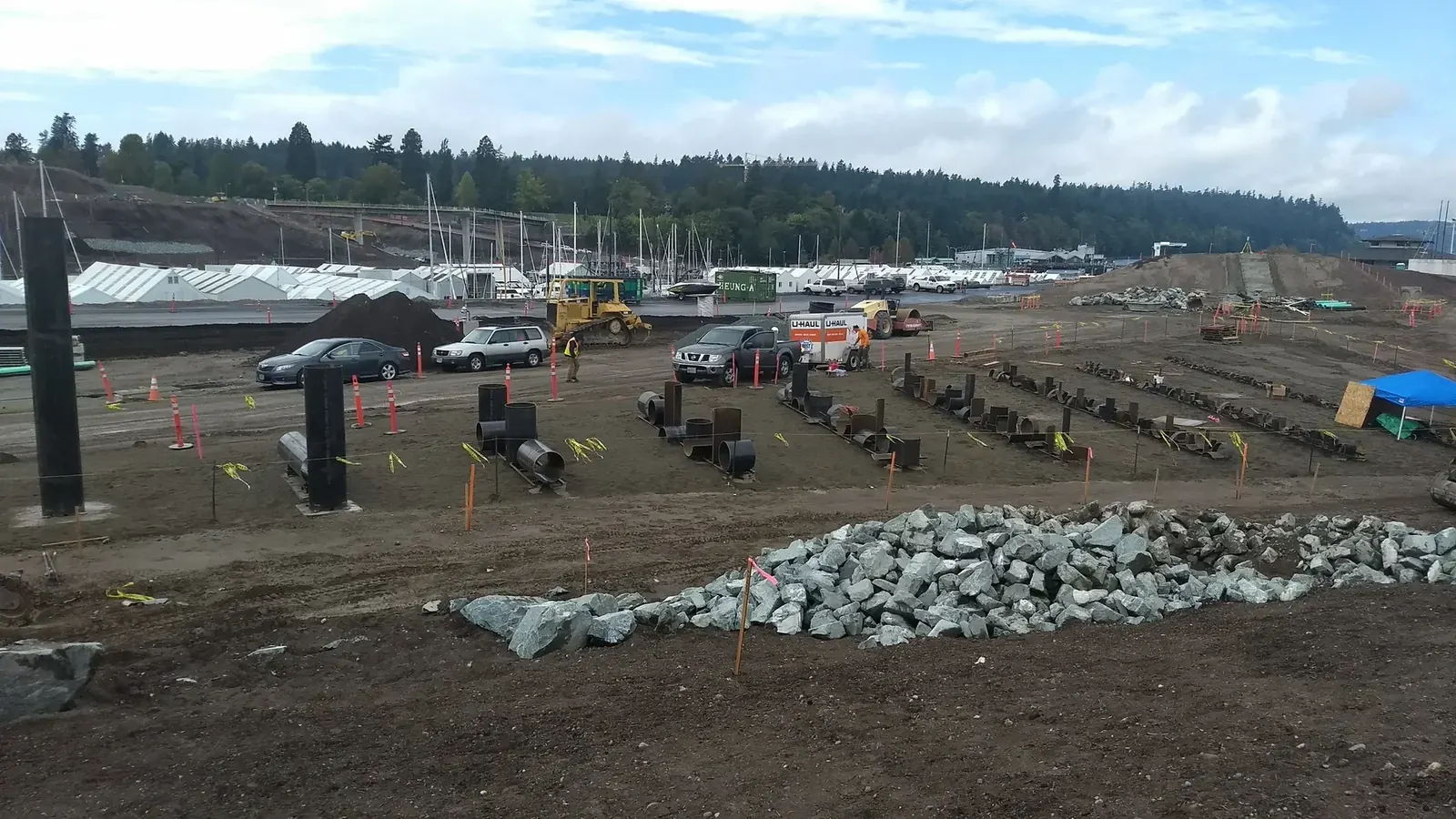 Elevated side view of the upright pipe and spreading rows of steel elements before paths and planting were installed.