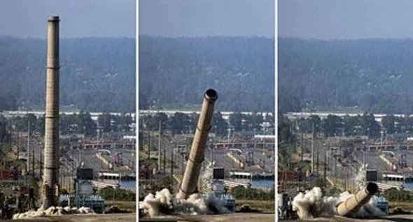 Three successive views show the ASARCO smelter smokestack standing, tipping over and falling during demolition.