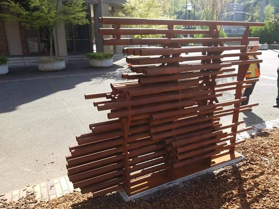 Reverse view of Anthropocene showing the steel plate supports behind the horizontal pipe array.