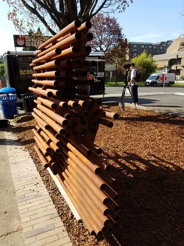 End view of Anthropocene, showing the open ends of the steel pipes and the depth of the array.
