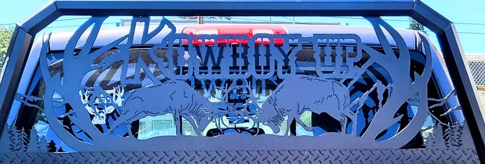 The truck rack with its Cowboy Up lettering.