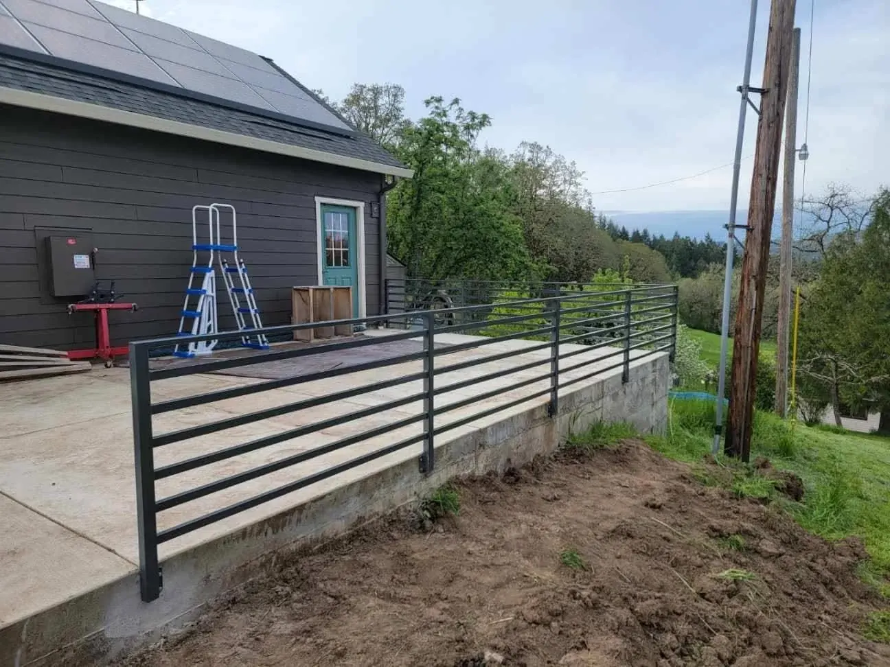 The railings beside the lawn.