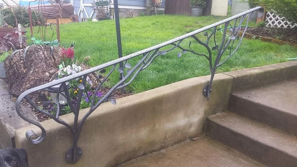 The handrail following the stair.