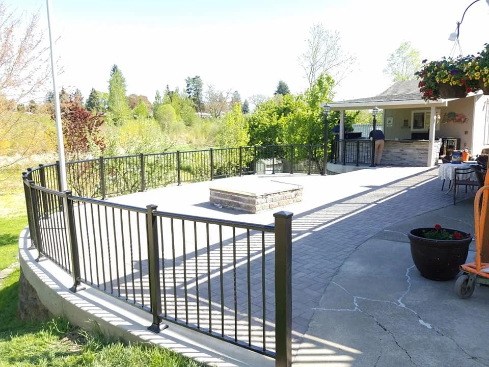 The terrace railings beside the lawn.