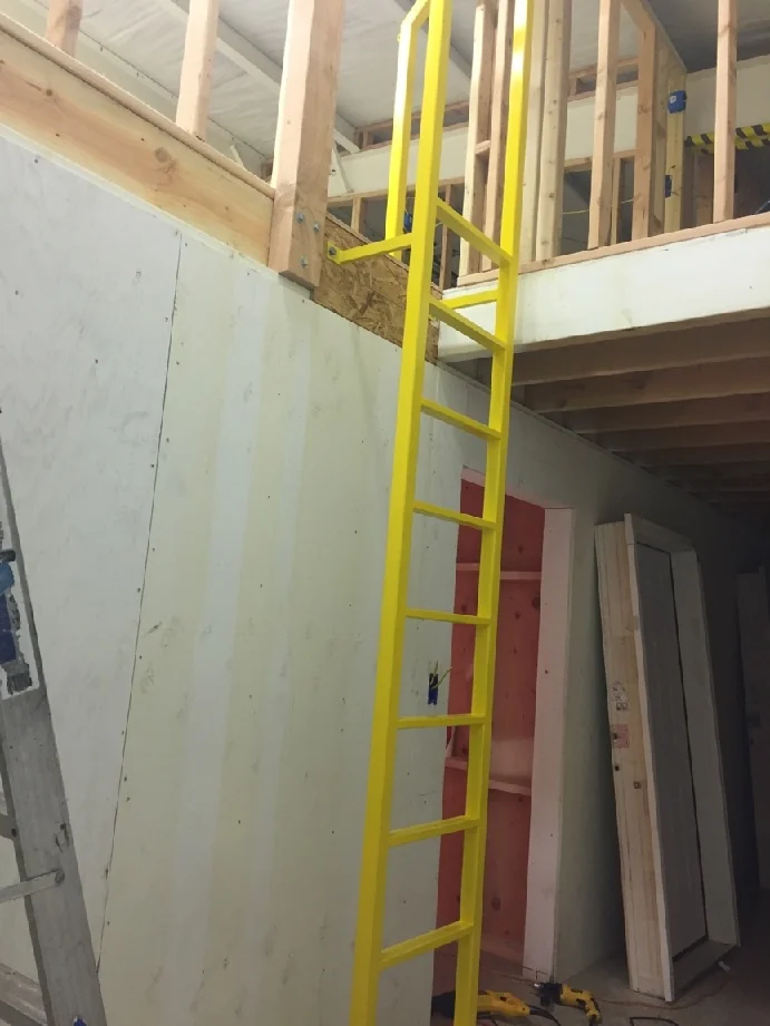The ladder and upper landing during building work.