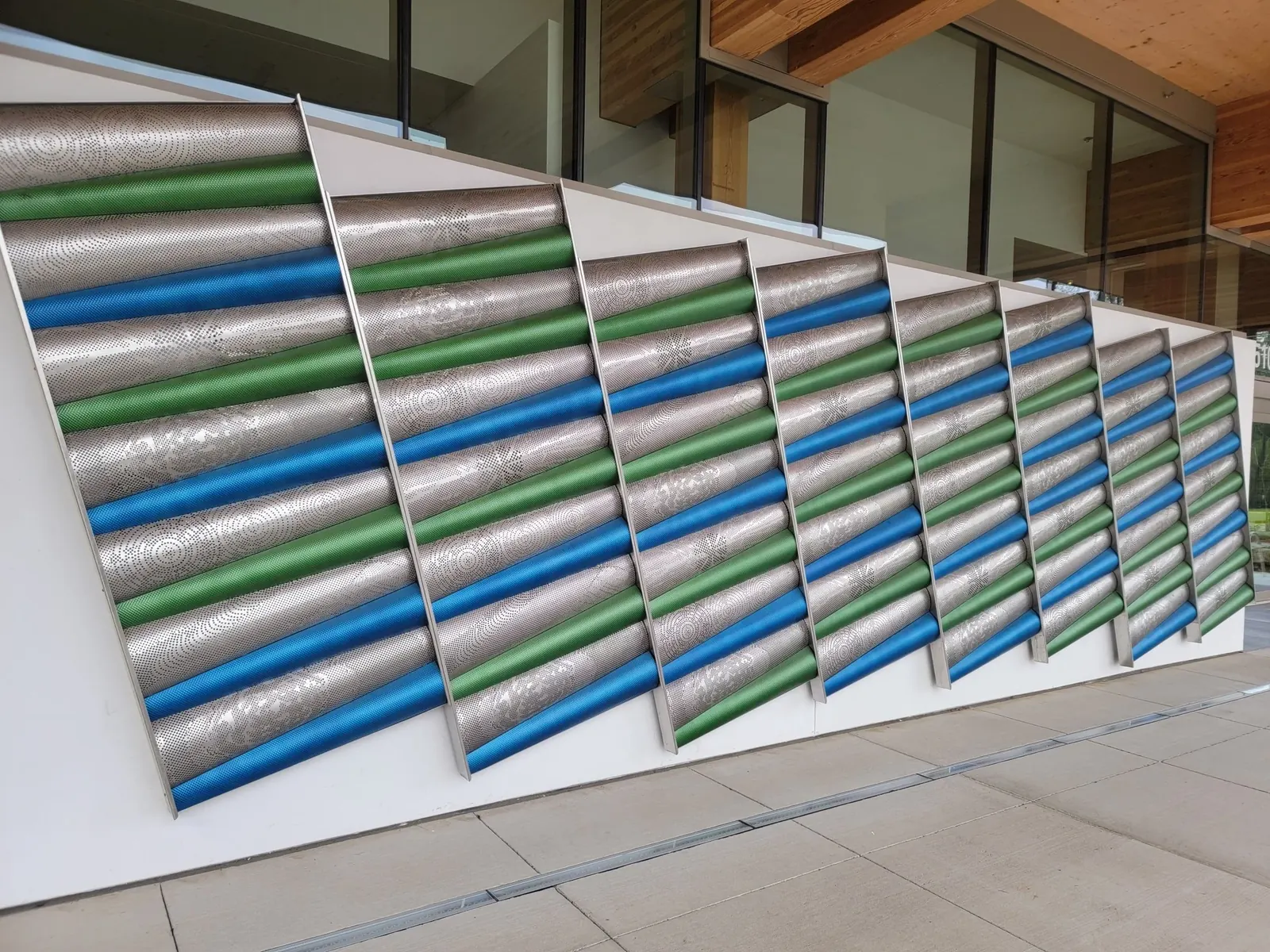 The finished pattern of blue and green conical forms.