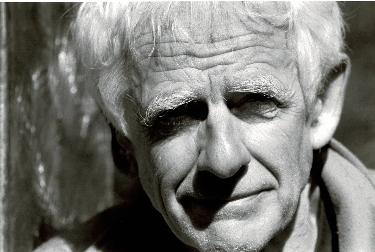 Black-and-white close-up portrait of Lee Kelly.