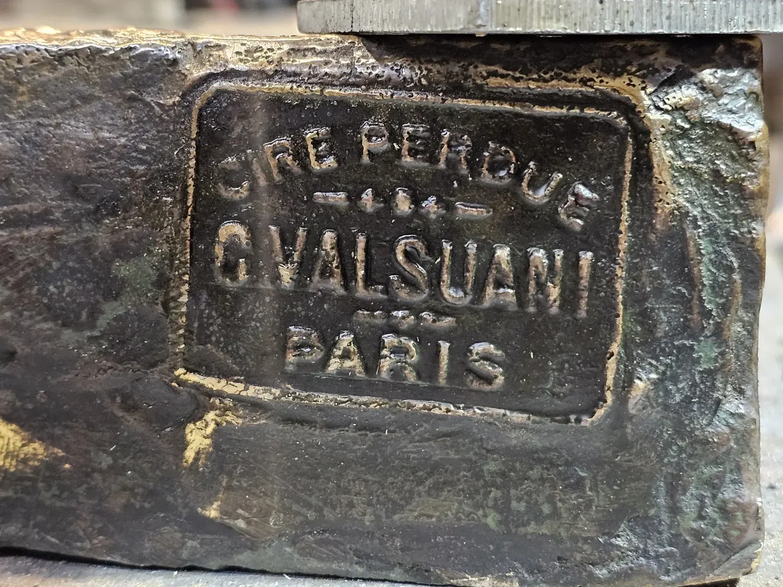Close photograph of the original Cire Perdue, C. Valsuani, Paris foundry mark in the bronze.