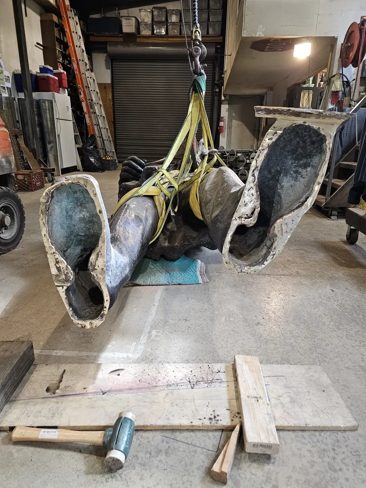 Undersides of the two hollow bronze feet while Lincoln is supported horizontally and the base is removed.