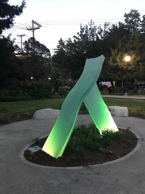 Lambda illuminated from below at dusk.