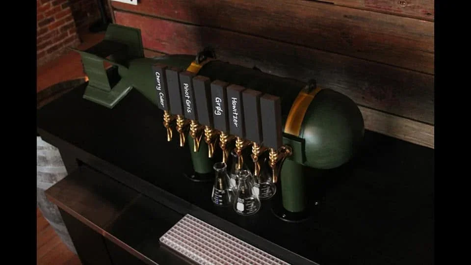 Completed green tap fixture installed behind a bar