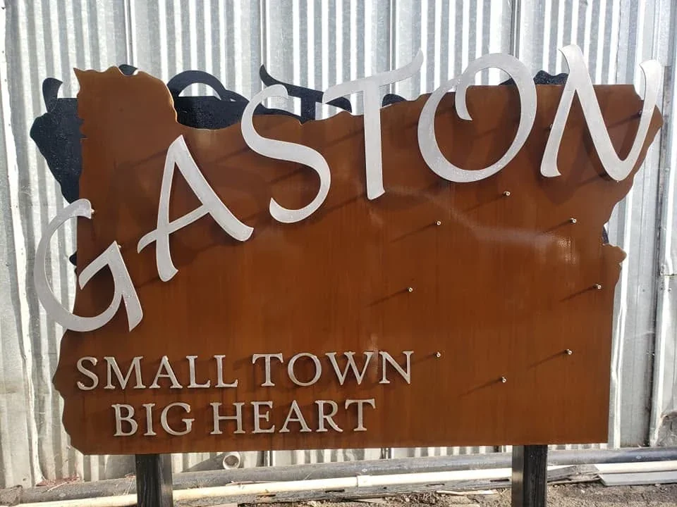 Assembled Gaston sign reading Small Town Big Heart