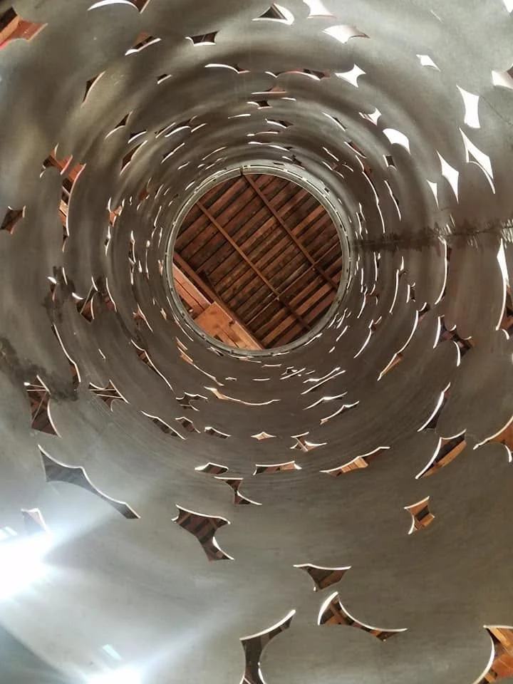 A view through the cylinder reveals the cut-metal pattern and its construction.